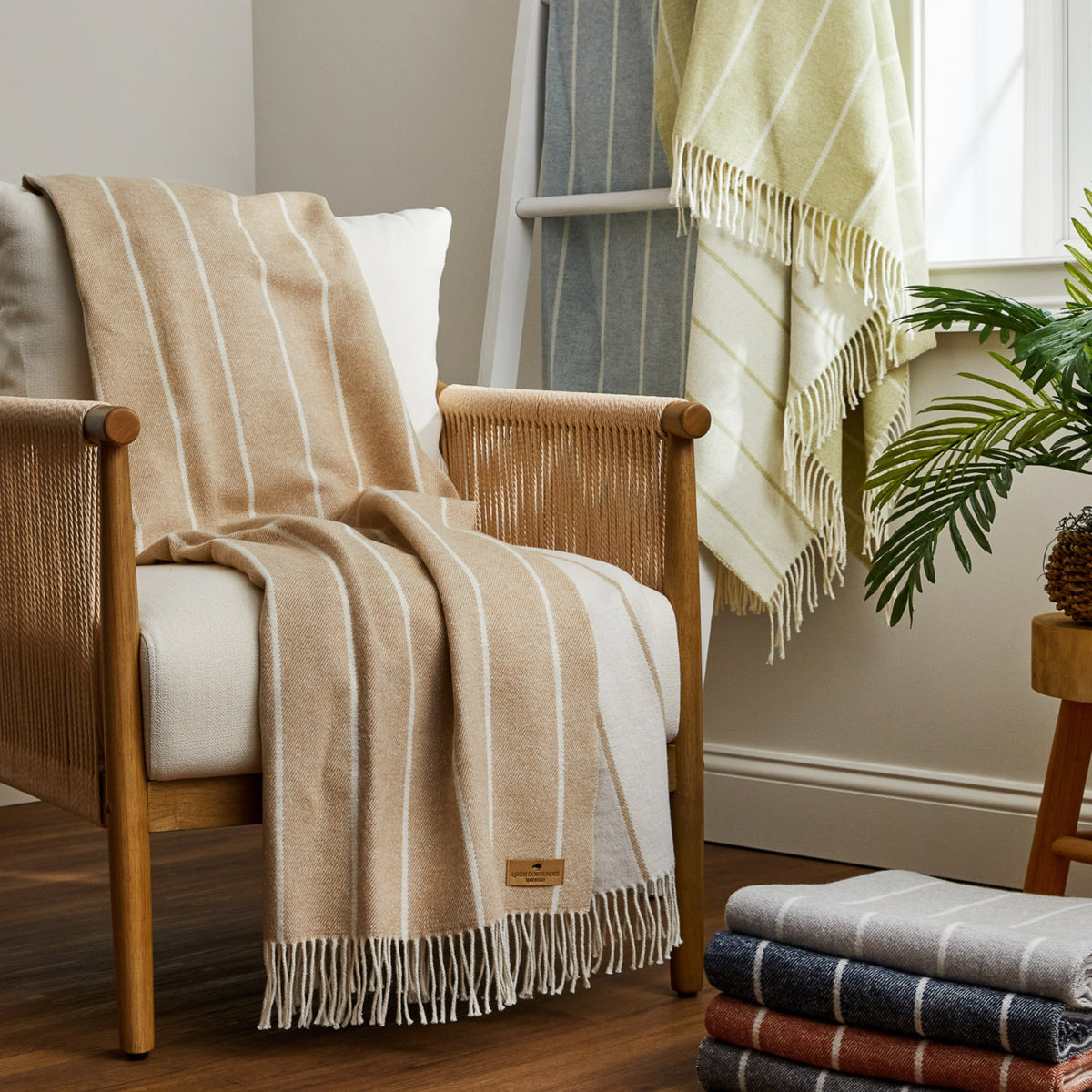 Neutral Fiji Stripe Throw blankets on chair and blanket ladder