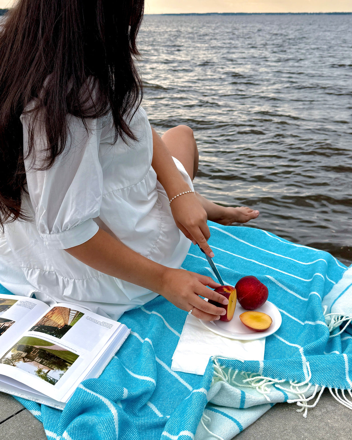 Fiji Stripe throw in Island Blue in a picnic setting