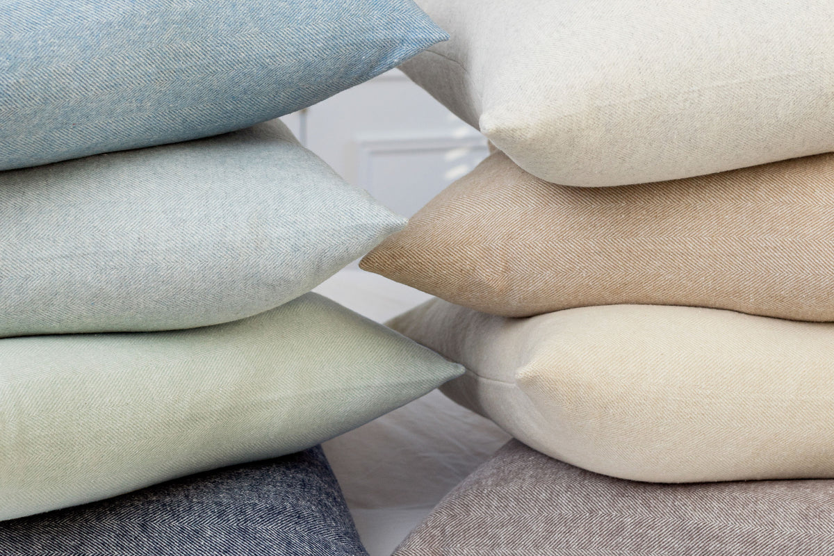 stack of herringbone throw pillows