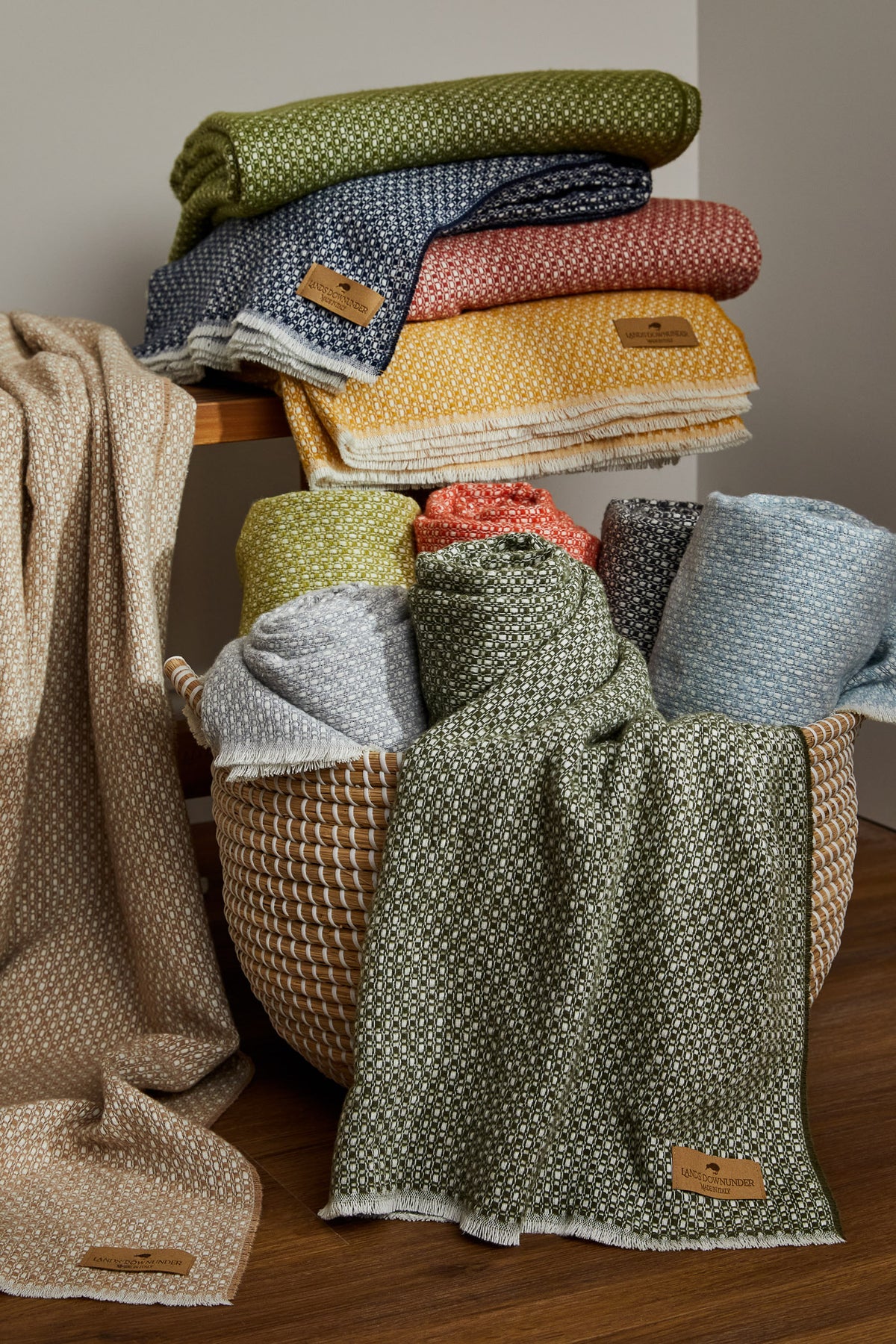 Hudson Valley collection on folded on a wooden bench and rolled in a basket