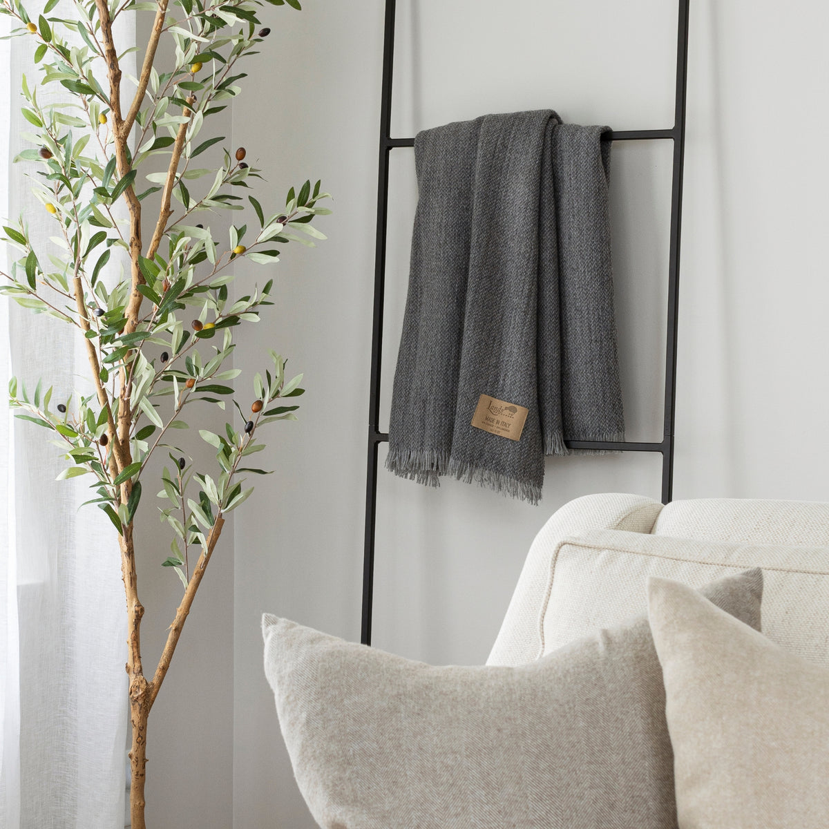 grey cashmere throw blanket on ladder
