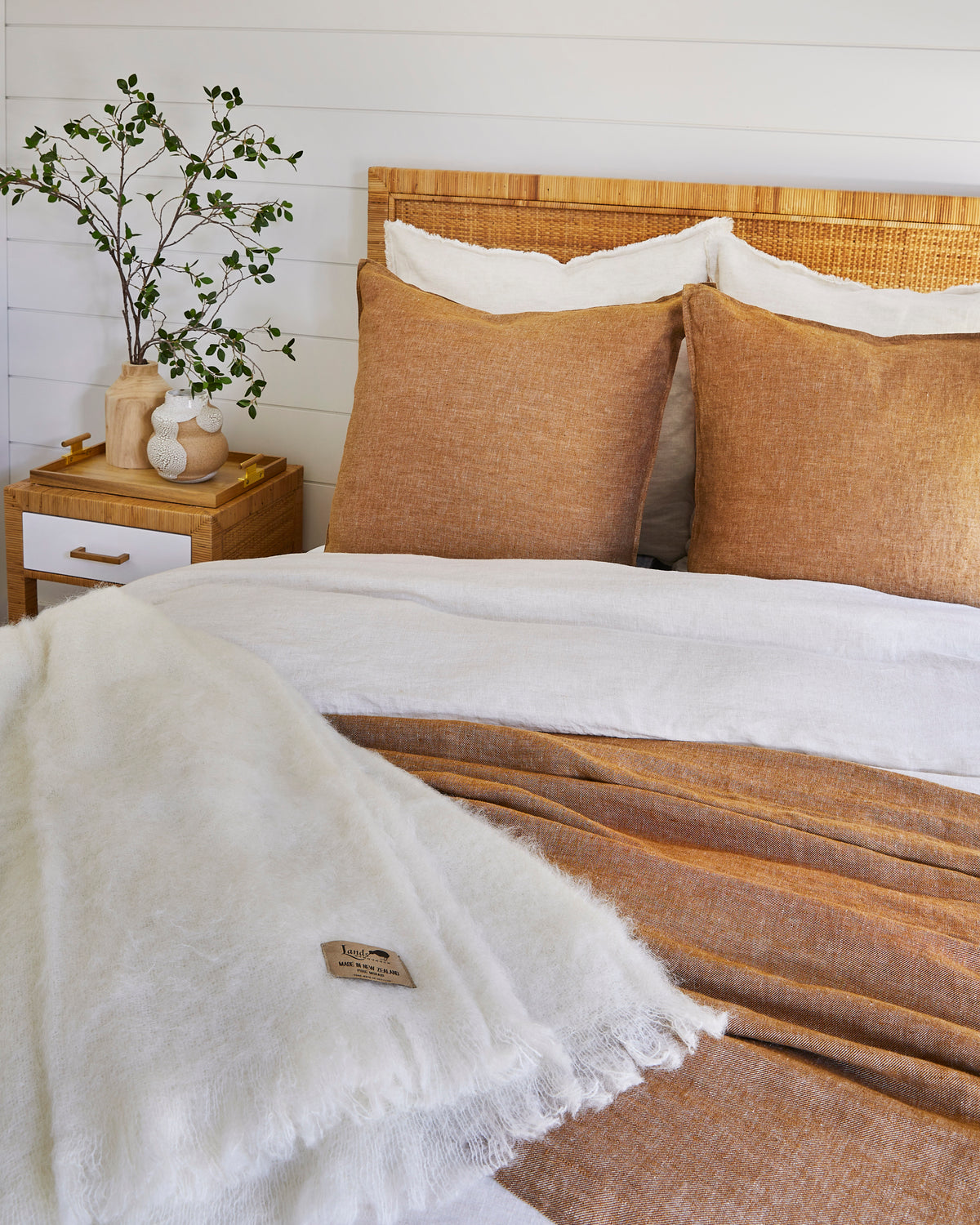 Cream New Zealand mohair throw on bed