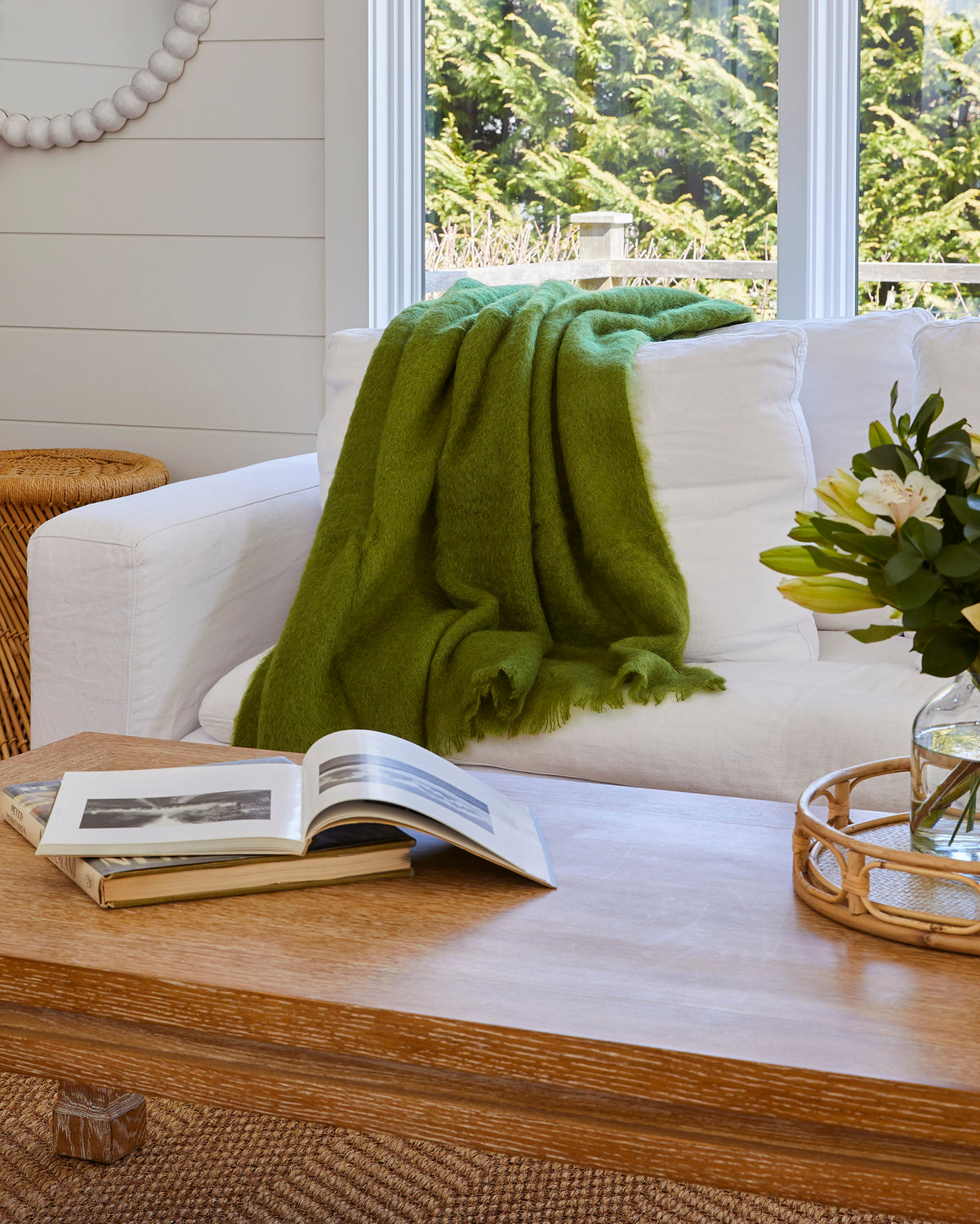 New Zealand Mohair throw blanket in Fern on couch